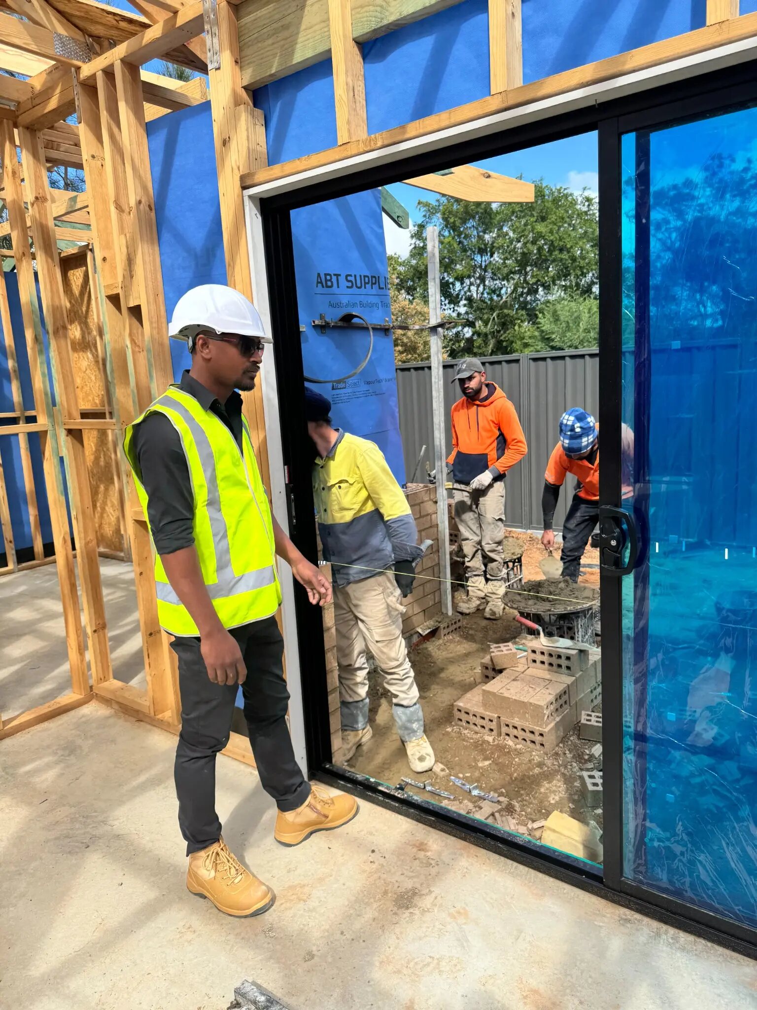 Maverick Builds coordinating brickwork and glazing details with trades