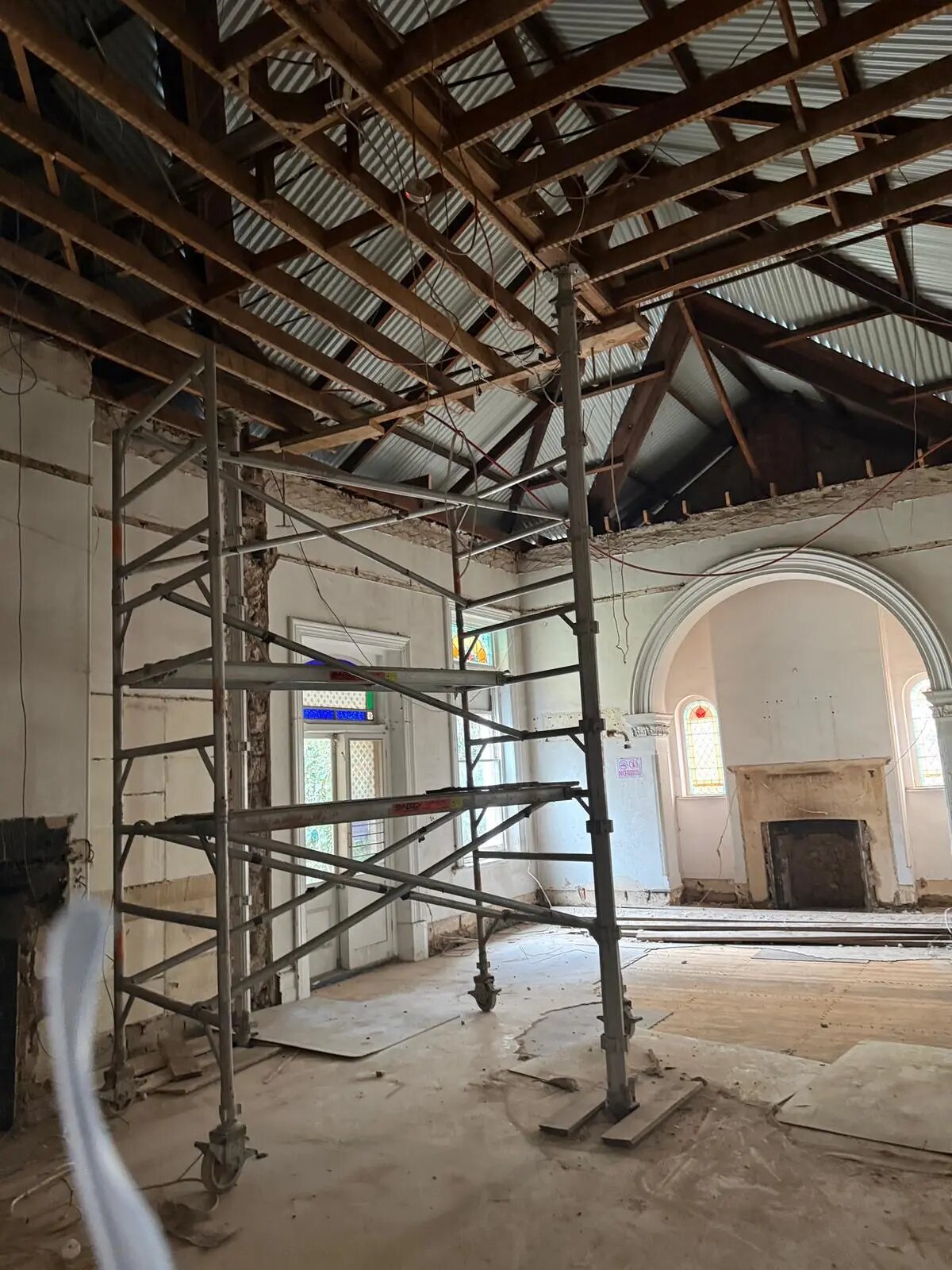 Exposed roof structure and scaffolding during a heritage renovation