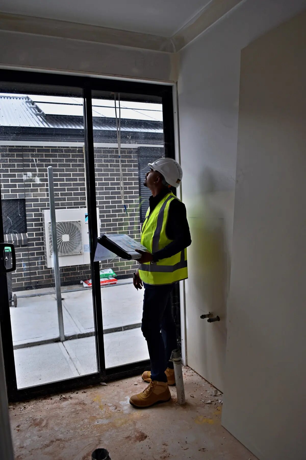 Imon Hussain inspecting an interior during residential construction