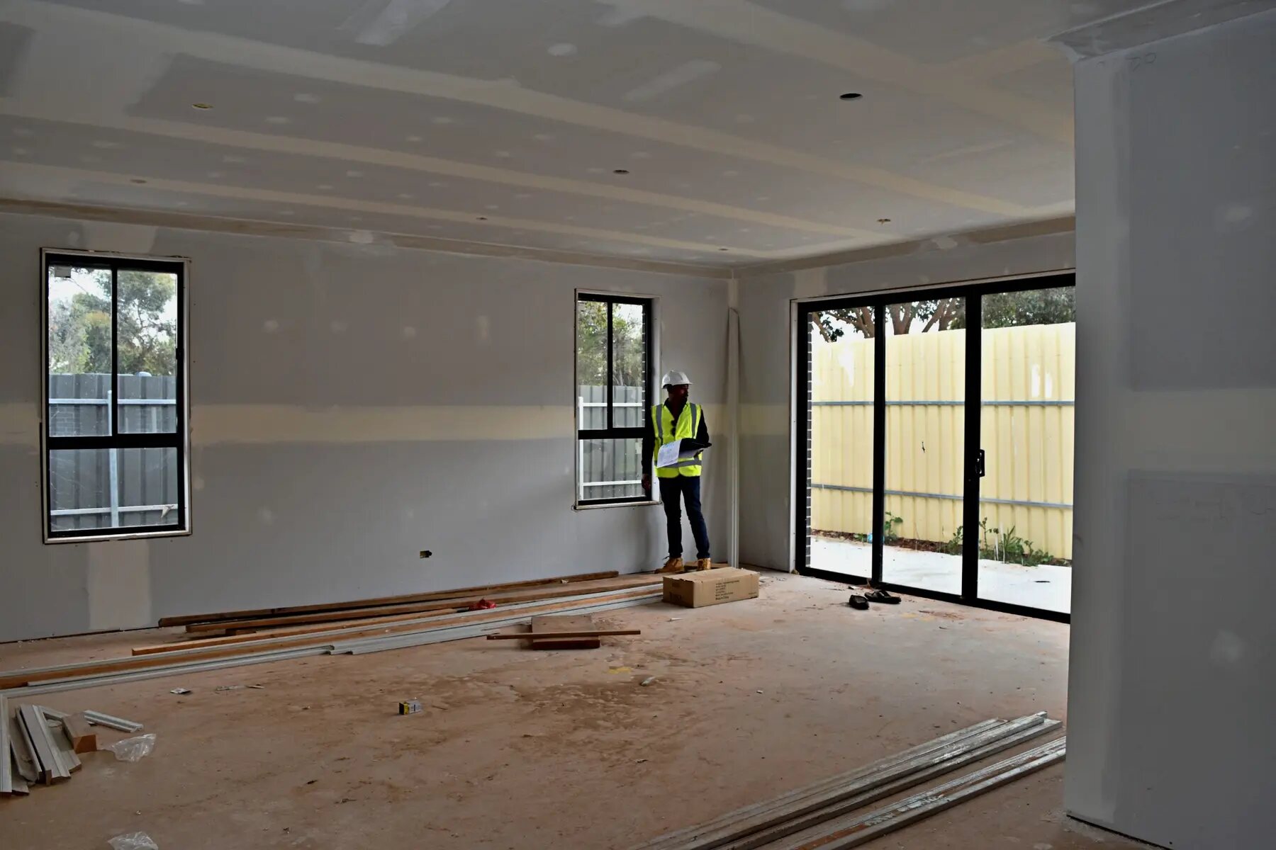 Large open-plan residential interior during the construction stage